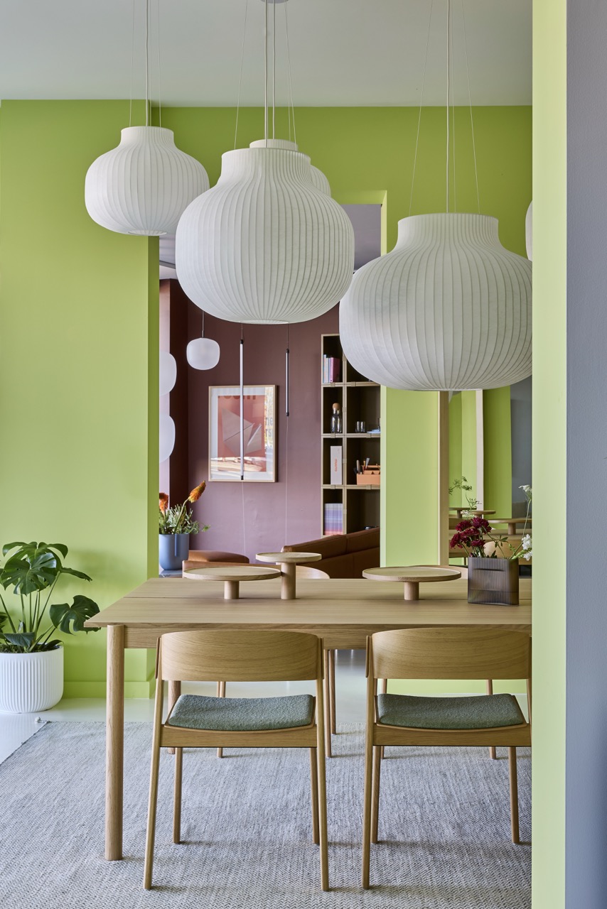 Muuto Strand Lamp lighting above the Linear System table, Sydney showroom